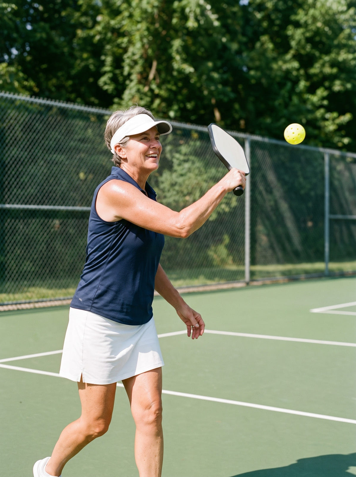 Woman in her late fifties playing pickleball